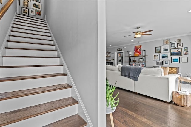 staircase featuring crown molding, recessed lighting, ceiling fan, and wood finished floors