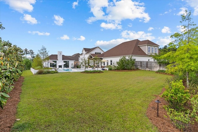 view of yard featuring a patio and fence