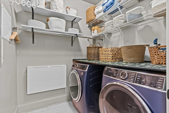 laundry room featuring separate washer and dryer, marble finish floor, laundry area, and baseboards