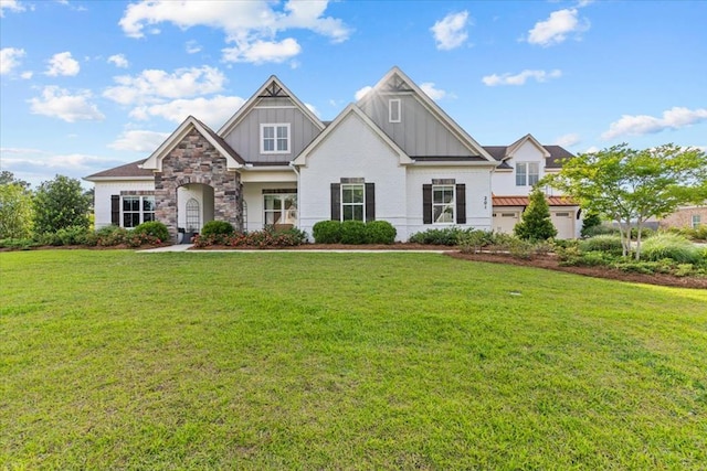 craftsman-style house featuring a front lawn and board and batten siding