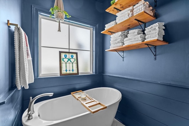bathroom with a soaking tub