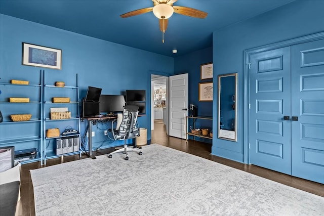 home office featuring a ceiling fan and wood finished floors