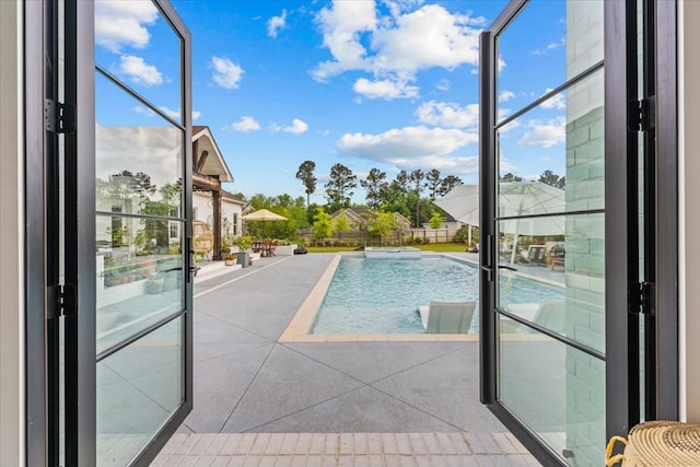 view of swimming pool featuring a patio and a fenced in pool
