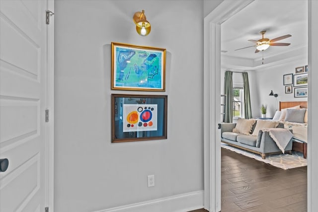 bedroom with wood finished floors and baseboards