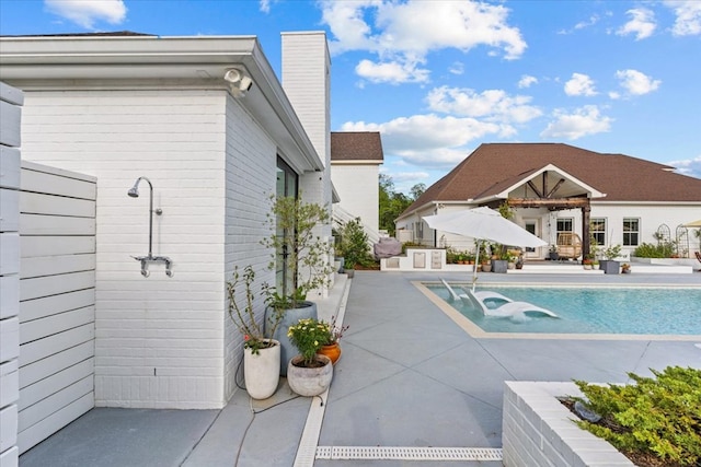 outdoor pool featuring a patio area