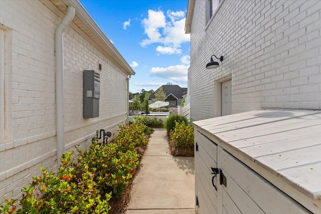 view of property exterior featuring brick siding