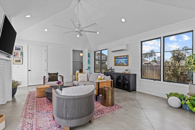 living room with lofted ceiling, concrete floors, and a healthy amount of sunlight