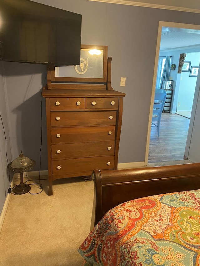 bedroom with carpet flooring and baseboards