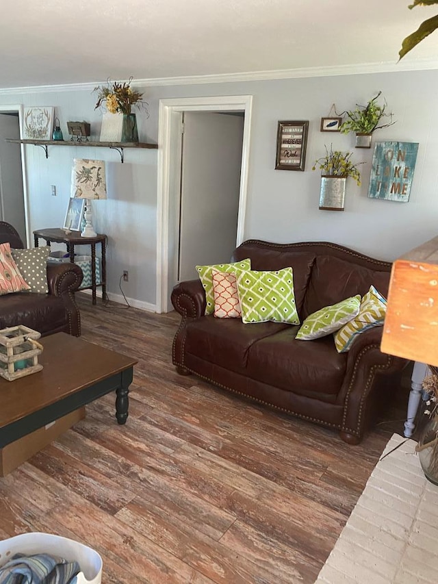 living area with crown molding and wood finished floors