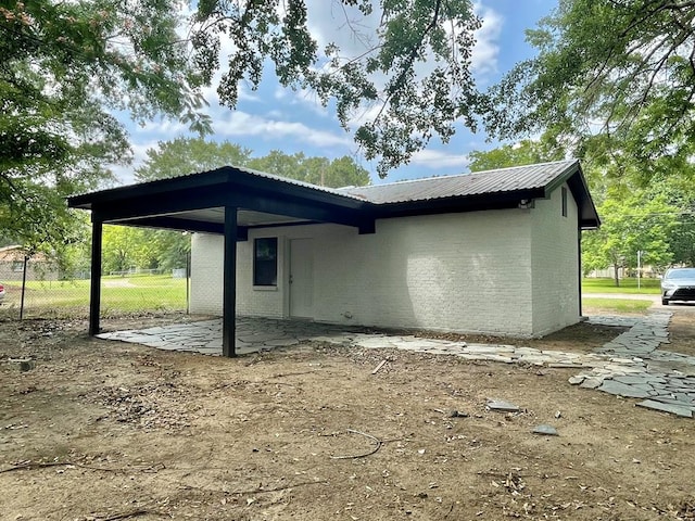 601 Melody Ln, Dothan, AL 36301 - view of home's exterior with brick siding and metal roof