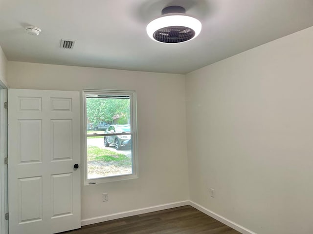 601 Melody Ln, Dothan, AL 36301 - spare room featuring dark wood-type flooring and baseboards