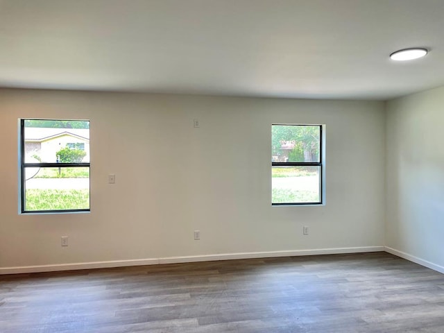 601 Melody Ln, Dothan, AL 36301 - unfurnished room featuring plenty of natural light, wood finished floors, and baseboards