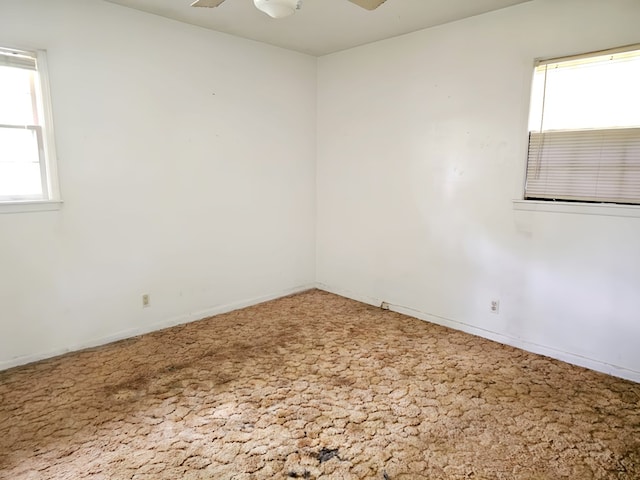 228 Sharon Ln, Ozark, AL 36360 - spare room featuring healthy amount of natural light, a ceiling fan, and carpet floors