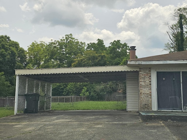 228 Sharon Ln, Ozark, AL 36360 - view of parking with driveway and a carport