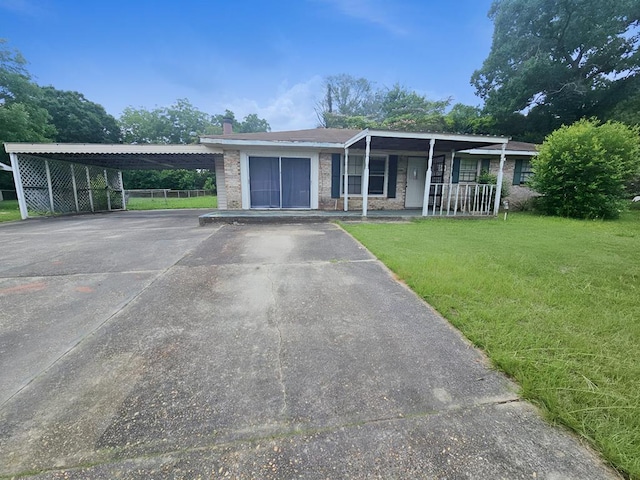 228 Sharon Ln, Ozark, AL 36360 - ranch-style house with driveway, a porch, and a chimney