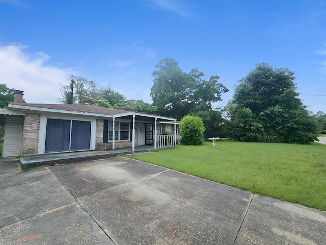 228 Sharon Ln, Ozark, AL 36360 - view of front facade featuring a front lawn, a porch, and brick siding