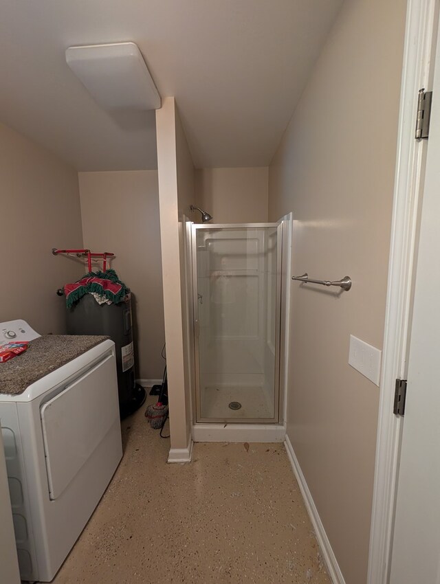 2302 Stonebridge Rd, Dothan, AL 36301 - bathroom featuring washer / dryer, a stall shower, and baseboards