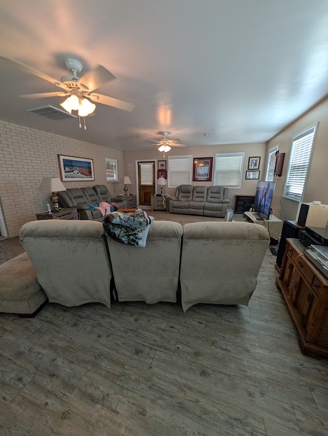 2302 Stonebridge Rd, Dothan, AL 36301 - living room featuring ceiling fan, wood finished floors, and brick wall