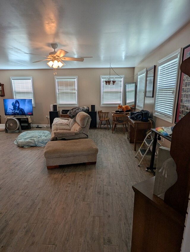 2302 Stonebridge Rd, Dothan, AL 36301 - living room with wood finished floors, plenty of natural light, a chandelier, and a ceiling fan