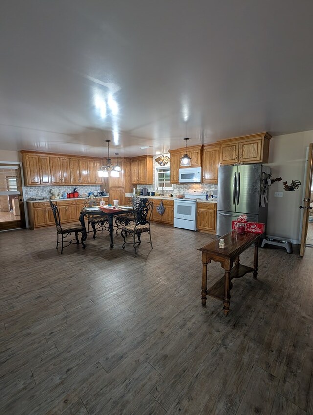 2302 Stonebridge Rd, Dothan, AL 36301 - dining space featuring dark wood-type flooring and a chandelier