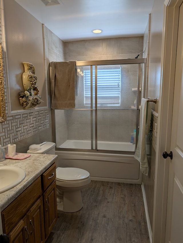 2302 Stonebridge Rd, Dothan, AL 36301 - full bath with vanity, toilet, combined bath / shower with glass door, and wood finished floors