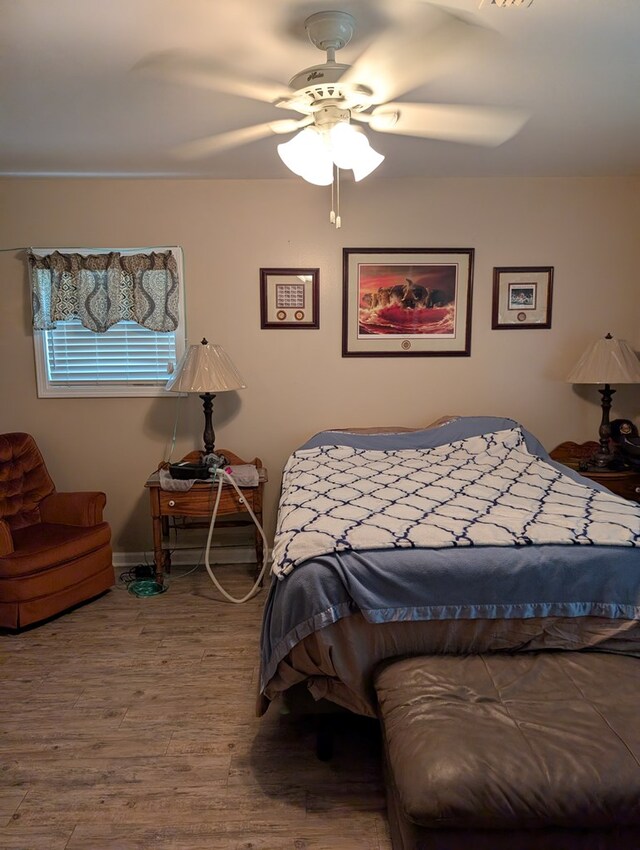 2302 Stonebridge Rd, Dothan, AL 36301 - bedroom featuring wood finished floors, ceiling fan, and baseboards