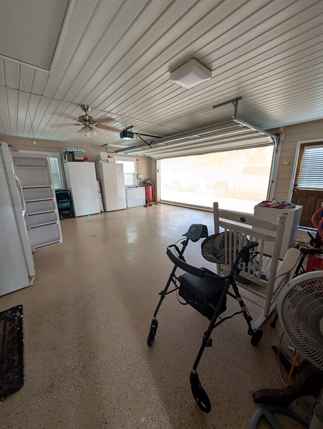 2302 Stonebridge Rd, Dothan, AL 36301 - garage with freestanding refrigerator and a garage door opener