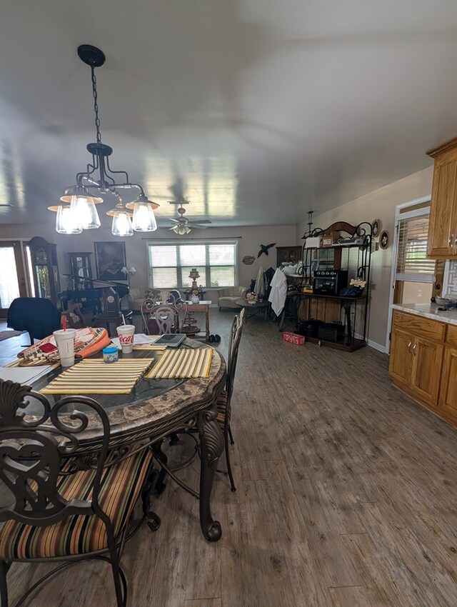 2302 Stonebridge Rd, Dothan, AL 36301 - dining room with dark wood finished floors, a ceiling fan, and a chandelier
