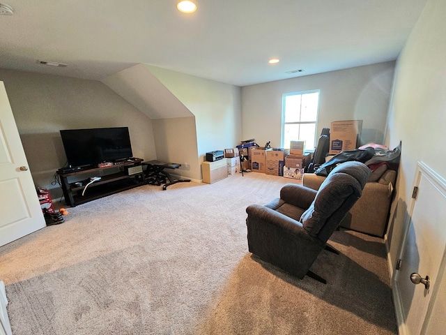 carpeted living room featuring lofted ceiling