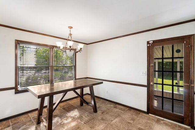 dining room with ornamental molding and an inviting chandelier