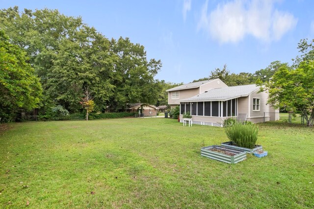 view of yard featuring a sunroom