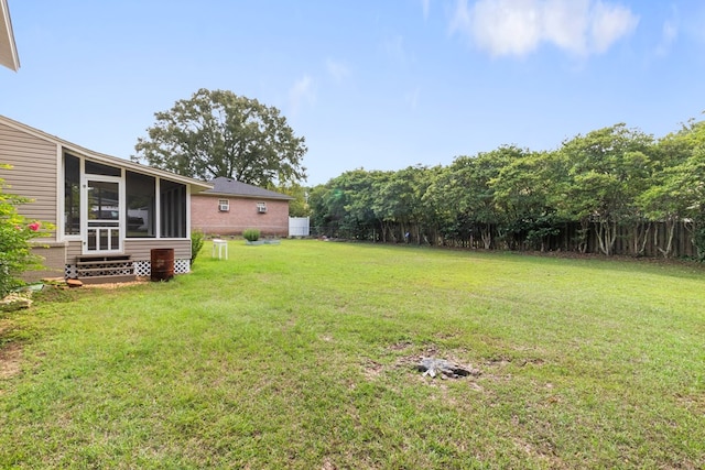 view of yard with a sunroom