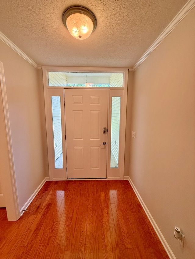 683 B Calhoun Dr, Abbeville, AL 36310 - entryway featuring a textured ceiling, wood finished floors, and crown molding