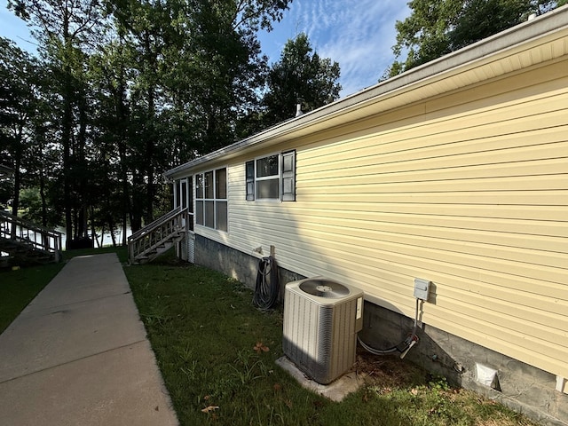 683 B Calhoun Dr, Abbeville, AL 36310 - view of side of home featuring a yard and stairway