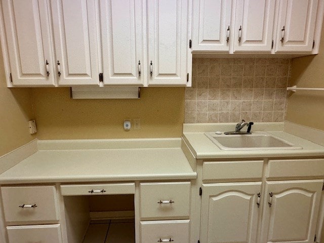 6 Woodmere Dr, Dothan, AL 36305 - kitchen with backsplash, white cabinets, and light countertops