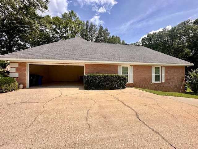 6 Woodmere Dr, Dothan, AL 36305 - view of front of property with driveway, a garage, brick siding, and a shingled roof