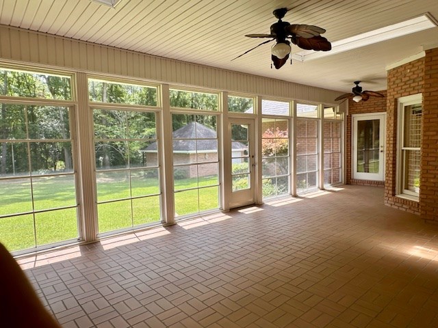 6 Woodmere Dr, Dothan, AL 36305 - unfurnished sunroom featuring a ceiling fan, brick patterned floors, and healthy amount of natural light