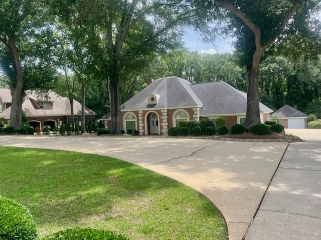 6 Woodmere Dr, Dothan, AL 36305 - view of front of house with a front lawn, driveway, and a detached garage