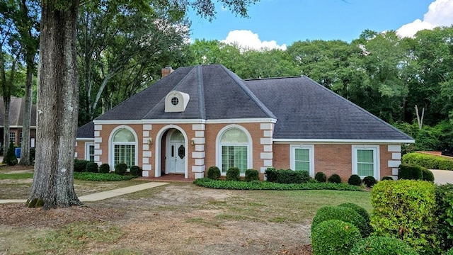 6 Woodmere Dr, Dothan, AL 36305 - view of front of property featuring brick siding, a chimney, a shingled roof, and a front yard