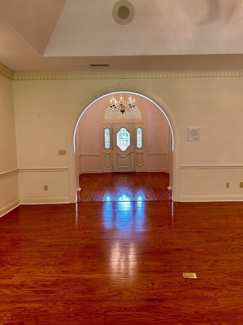 6 Woodmere Dr, Dothan, AL 36305 - foyer entrance featuring arched walkways, wood finished floors, and a decorative wall