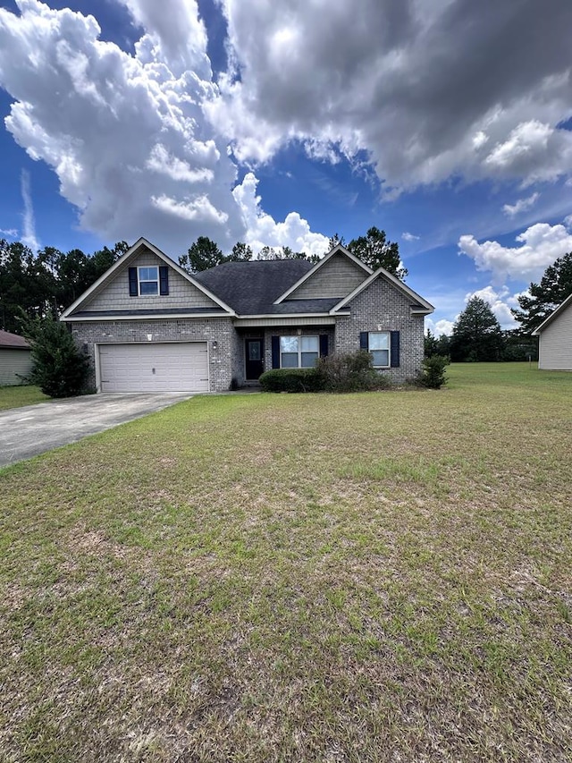 112 Covenant Dr, Dothan, AL 36303 - view of front facade with a garage, driveway, a front lawn, and brick siding