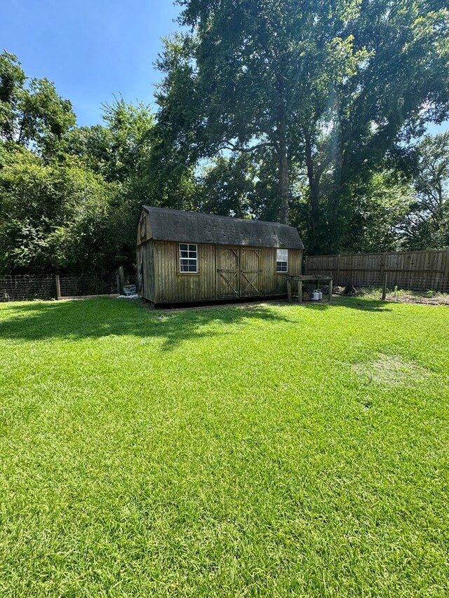 109 Pinehurst Dr, Ashford, AL 36312 - fenced backyard with a storage shed