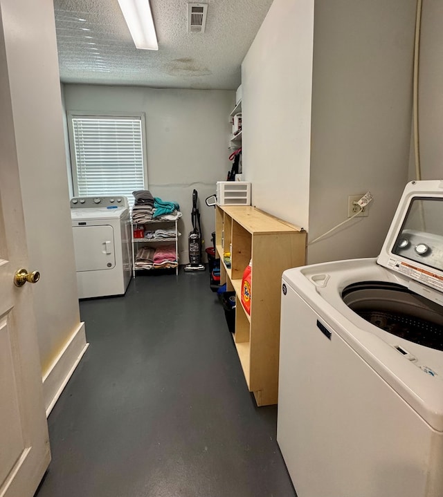 109 Pinehurst Dr, Ashford, AL 36312 - washroom with a textured ceiling and independent washer and dryer