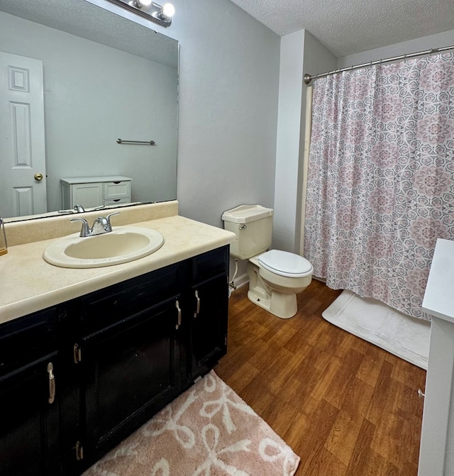 109 Pinehurst Dr, Ashford, AL 36312 - full bath featuring vanity, a textured ceiling, wood finished floors, and a shower with shower curtain