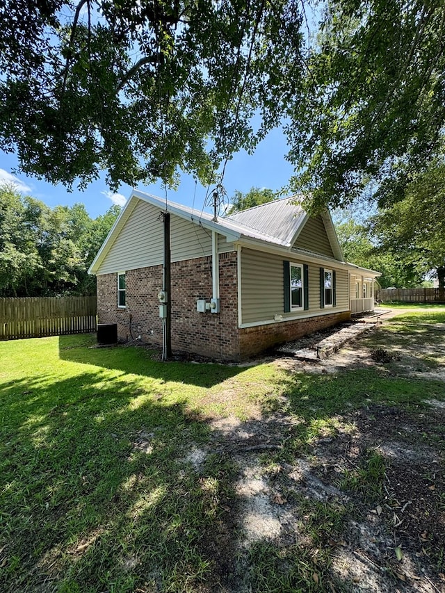 109 Pinehurst Dr, Ashford, AL 36312 - view of home's exterior with brick siding and a metal roof