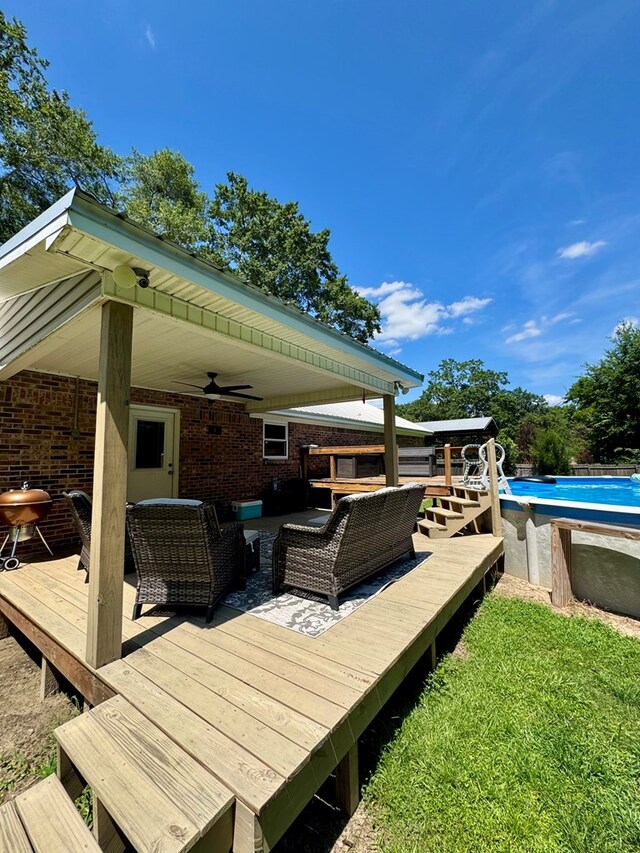 109 Pinehurst Dr, Ashford, AL 36312 - deck with ceiling fan, an outdoor pool, and an outdoor living space