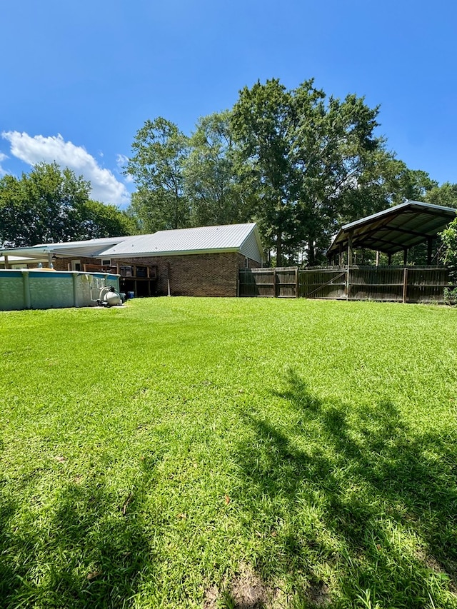 109 Pinehurst Dr, Ashford, AL 36312 - view of yard with a detached carport and an outdoor pool