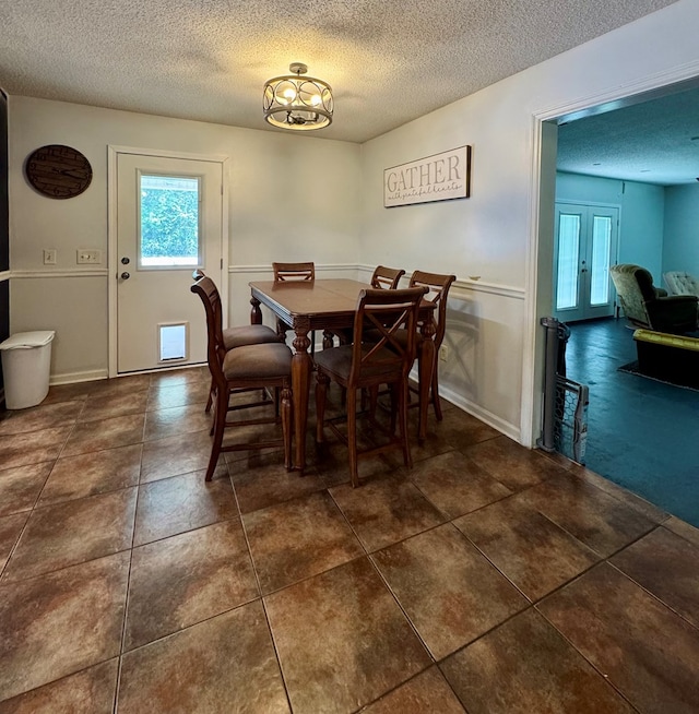109 Pinehurst Dr, Ashford, AL 36312 - tiled dining space featuring a textured ceiling and healthy amount of natural light