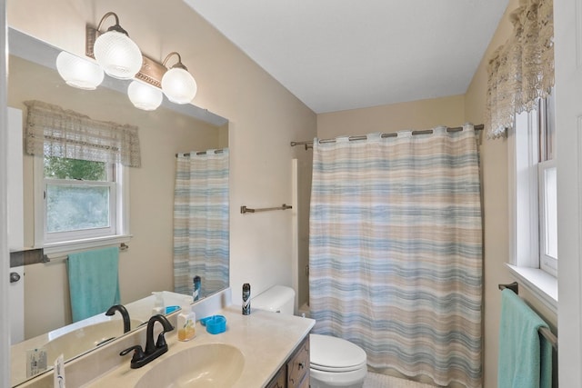 bathroom with vanity, a shower with curtain, and toilet