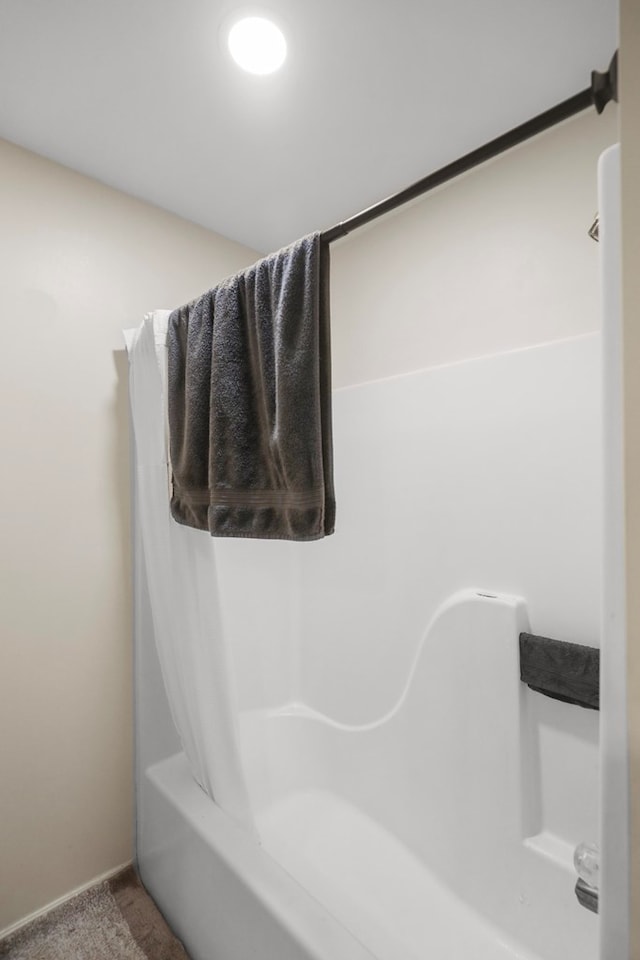 bathroom with shower / bathtub combination with curtain